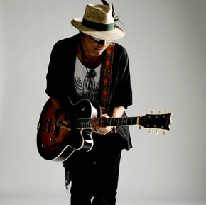 Mellow Blues is a guitarist and singer-songwriter whose music incorporates elements of blues, jazz and folk. He conducts remote online blues, rock and jazz guitar lessons via Skype, Zoom and Microsoft Teams video calls.