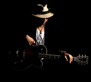 Mellow Blues is a guitarist and singer-songwriter whose music incorporates elements of blues, jazz, folk and bossa nova. He conducts remote online blues, rock and jazz guitar lessons via Skype, Zoom and Microsoft Teams video calls.